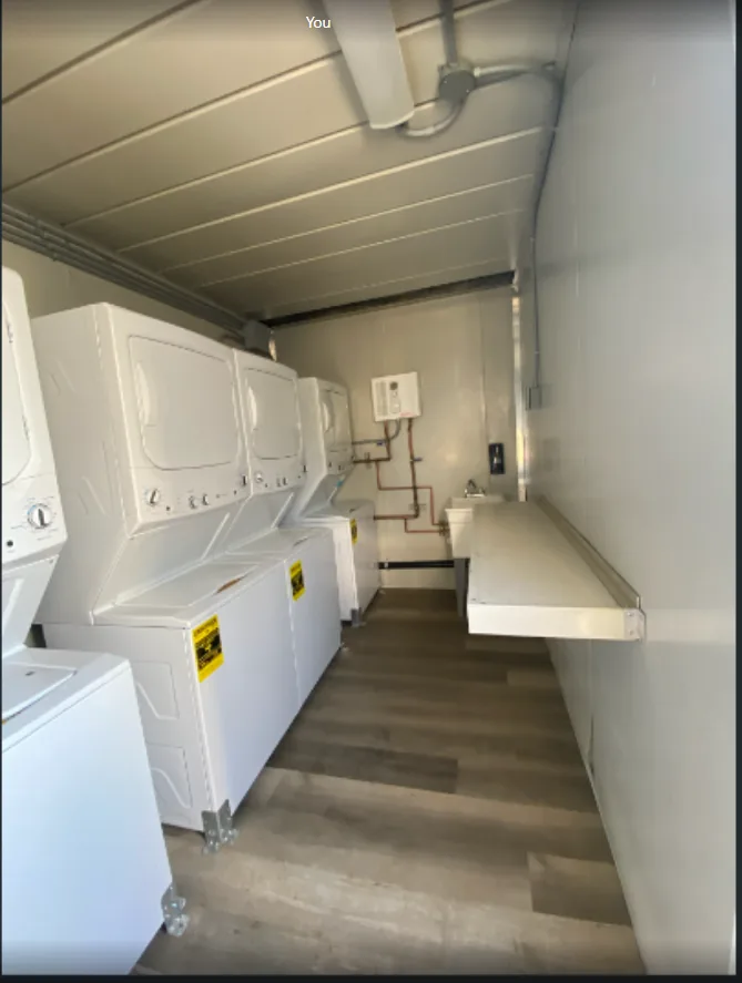 Laundry container interior with multiple washing machines